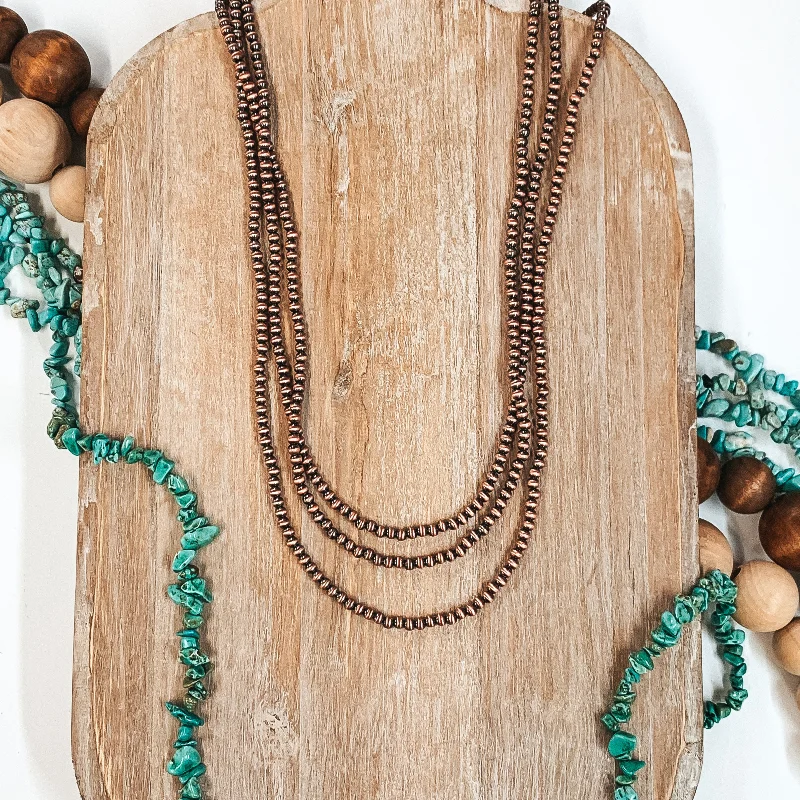 blue topaz necklaces for women-Three Strands of Long Faux Navajo Pearls in Copper Tone